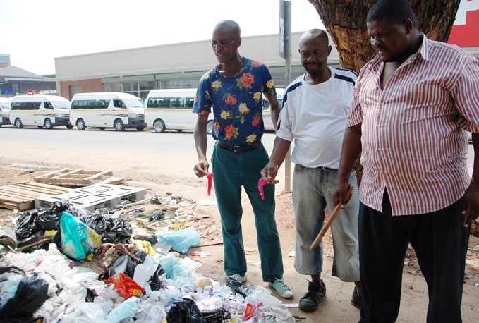 Mabopane taxi drivers hold some used condoms they say were dumped by magoshas.